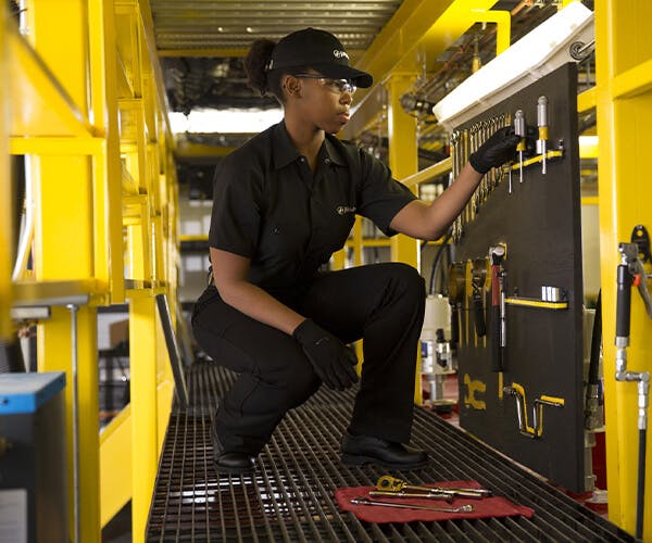 Jiffy Lube employee getting tools