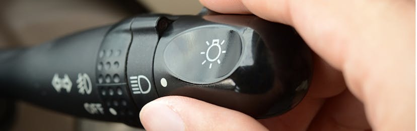 hand turning on car high beams