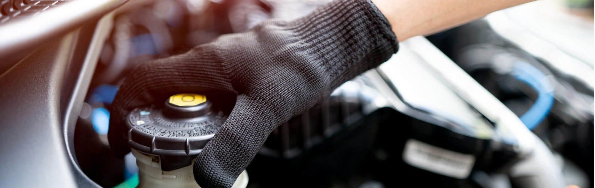 Jiffy Lube technician conducting a brake fluid test