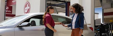customer picking up their vehicle after a car inspection