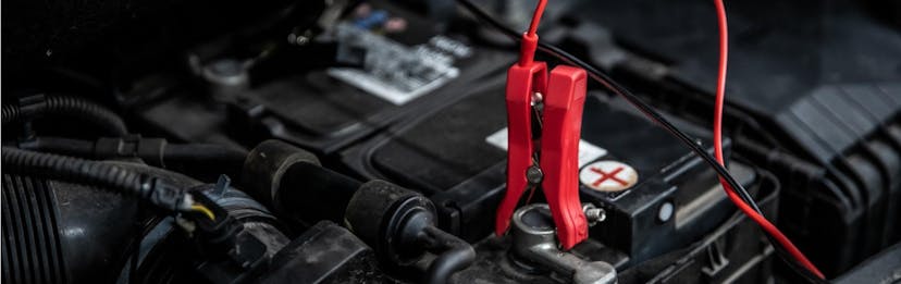 jumper cable on car battery in order to charge it