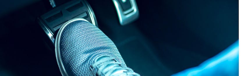 close up on foot pressing the brake