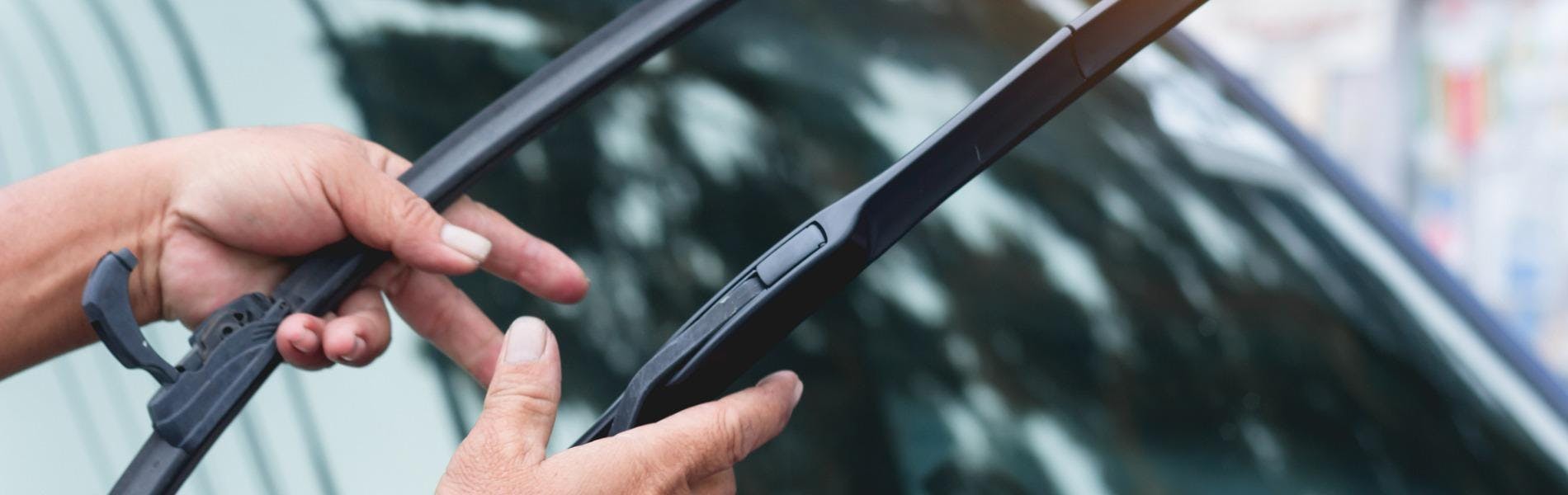 Mechanic replaces windshield wipers