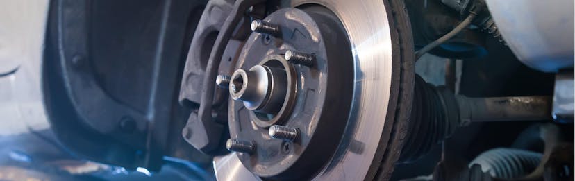 Close up view of a wheel well during a brake inspection