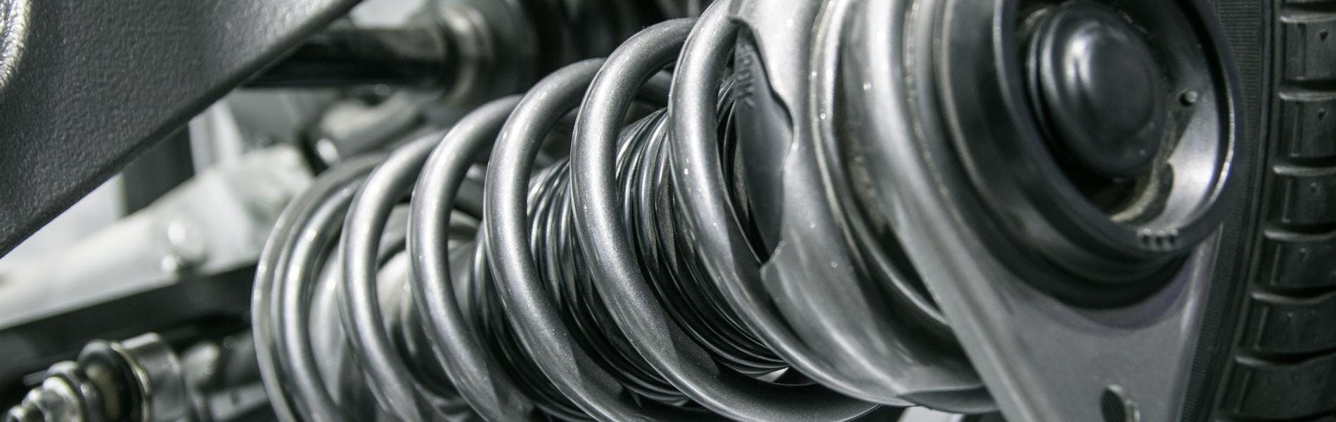 A vehicle suspension coil close up view