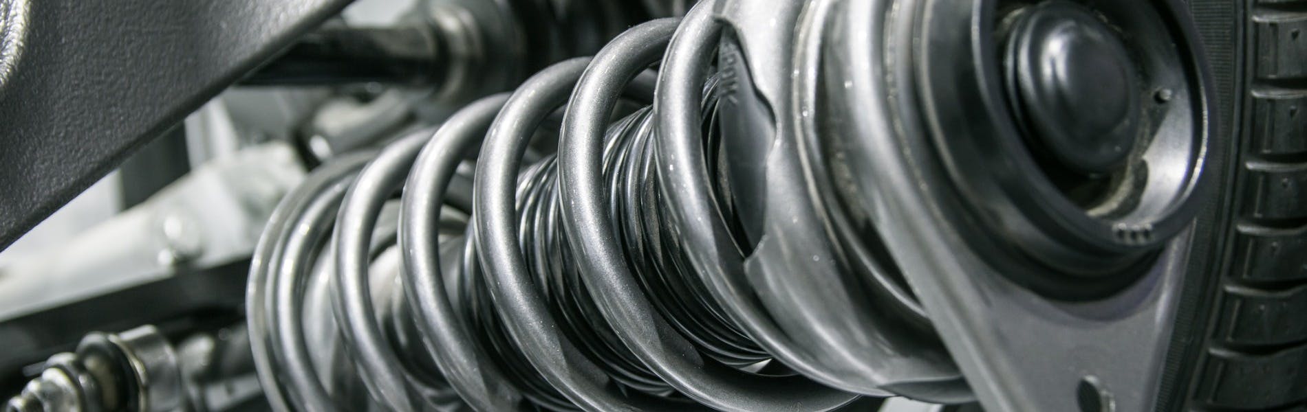 A vehicle suspension coil close up view